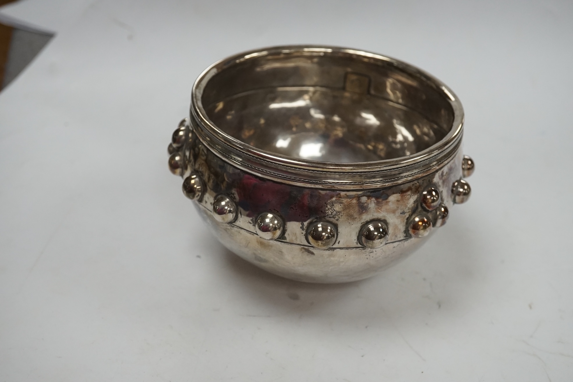 A late Victorian Arts and Crafts silver bowl, with studded band, maker SS, Chester, 1899, diameter 11.2cm, 8.4oz. Condition - fair to good